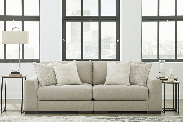 Distinguished yet unassuming, the versatile and visually appealing Lyndeboro loveseat adds a refined touch to any space. Inspired by the dapper look of fine tailored menswear, its rich texture turns heads, while a soft, light gray hue blends effortlessly with other colors in the room. Clean lines and wide track arms embrace a minimalist contemporary style. The loveseat's modular design offers a variety of configurations for flexibility. Plush, reversible deep cushions provide extraordinary comfort and can be rotated for longer life. Accent pillows in soft shades of complementary colors add subtle contrast. This handsome piece will make a memorable impression again and again.Includes 2 pieces: left-arm facing corner chair and right-arm facing corner chair | "Left-arm" and "right-arm" describe the position of the arm when you face the piece | Corner-blocked frame | High-resiliency foam cushions wrapped in thick poly fiber | Reversible cushions | Polyester upholstery | Toss pillows included | Pillows with feather blend inserts | Exposed feet with faux wood finish | Platform foundation system resists sagging 3x better than spring system after 20,000 testing cycles by providing more even support | Smooth platform foundation maintains tight, wrinkle-free look without dips or sags that can occur over time with sinuous spring foundations | Estimated Assembly Time: 5 Minutes