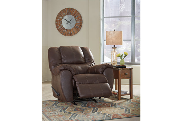 Rock the cool look of leather and the warm feel of fabric with the McGann rocker recliner. Sporting sumptuously thick cushioning, fashion-forward jumbo stitching and a richly tailored aesthetic, this smartly priced recliner with gentle rocking motion is a bestseller for good reason.One-pull reclining motion | Corner-blocked frame with metal reinforced seat | Attached cushions | High-resiliency foam cushions wrapped in thick poly fiber | Polyester/polyurethane upholstery