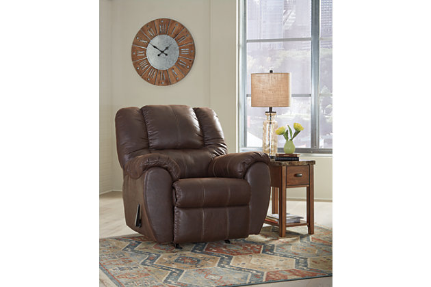 Rock the cool look of leather and the warm feel of fabric with the McGann rocker recliner. Sporting sumptuously thick cushioning, fashion-forward jumbo stitching and a richly tailored aesthetic, this smartly priced recliner with gentle rocking motion is a bestseller for good reason.One-pull reclining motion | Corner-blocked frame with metal reinforced seat | Attached cushions | High-resiliency foam cushions wrapped in thick poly fiber | Polyester/polyurethane upholstery