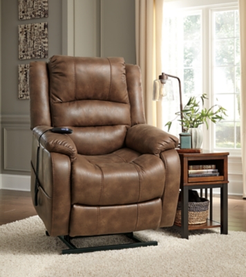 Double your pleasure and your sense of style with the Yandel power lift recliner. Dual motor capability gives you the freedom to recline back and elevate your legs independently for more custom comfort positioning. And with the touch of a button, power lift feature gently eases you from the ultimate slumber into a lift-and-tilt position to get you back on your feet, effortlessly.  Designer upholstery may look like gently battered leather, but it’s actually a feel-good fabric with warm, cozy appeal.One-touch (hand control) power button with adjustable positions | Corner-blocked frame with metal reinforced seat | Attached cushions | High-resiliency foam cushions wrapped in thick poly fiber | Side pocket storage | Dual motors control the footrest and back independently for custom comfort positioning | Emergency battery backup runs on two 9-volt batteries (not included), in case of power outage | Power cord included; UL Listed | Polyester upholstery | Excluded from promotional discounts and coupons | Estimated Assembly Time: 15 Minutes