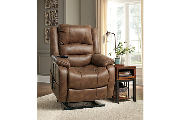 Double your pleasure and your sense of style with the Yandel power lift recliner. Dual motor capability gives you the freedom to recline back and elevate your legs independently for more custom comfort positioning. And with the touch of a button, power lift feature gently eases you from the ultimate slumber into a lift-and-tilt position to get you back on your feet, effortlessly.  Designer upholstery may look like gently battered leather, but it’s actually a feel-good fabric with warm, cozy appeal.One-touch (hand control) power button with adjustable positions | Corner-blocked frame with metal reinforced seat | Attached cushions | High-resiliency foam cushions wrapped in thick poly fiber | Side pocket storage | Dual motors control the footrest and back independently for custom comfort positioning | Emergency battery backup runs on two 9-volt batteries (not included), in case of power outage | Power cord included; UL Listed | Polyester upholstery | Excluded from promotional discounts and coupons | Estimated Assembly Time: 15 Minutes