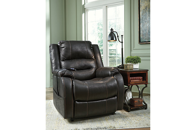 Double your pleasure and your sense of style with the Yandel power lift recliner. Dual motor capability gives you the freedom to recline back and elevate your legs independently for more custom comfort positioning. Designer upholstery may look like gently battered leather, but it’s actually a feel-good fabric with warm, cozy appeal.One-touch (hand control) power button with adjustable positions | Corner-blocked frame with metal reinforced seat | Attached cushions | High-resiliency foam cushions wrapped in thick poly fiber | Side pocket storage | Dual motors control the footrest and back independently for custom comfort positioning | Emergency battery backup runs on two 9-volt batteries (not included), in case of power outage | Power cord included; UL Listed | Polyester upholstery | Excluded from promotional discounts and coupons | Estimated Assembly Time: 15 Minutes
