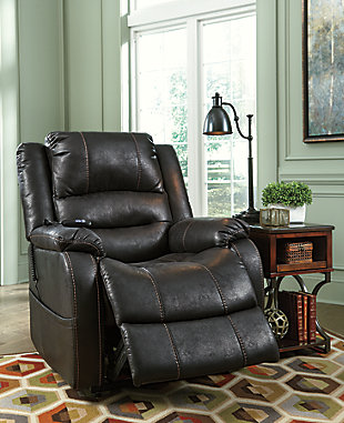 Double your pleasure and your sense of style with the Yandel power lift recliner. Dual motor capability gives you the freedom to recline back and elevate your legs independently for more custom comfort positioning. Designer upholstery may look like gently battered leather, but it’s actually a feel-good fabric with warm, cozy appeal.One-touch (hand control) power button with adjustable positions | Corner-blocked frame with metal reinforced seat | Attached cushions | High-resiliency foam cushions wrapped in thick poly fiber | Side pocket storage | Dual motors control the footrest and back independently for custom comfort positioning | Emergency battery backup runs on two 9-volt batteries (not included), in case of power outage | Power cord included; UL Listed | Polyester upholstery | Excluded from promotional discounts and coupons | Estimated Assembly Time: 15 Minutes