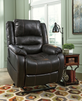 Double your pleasure and your sense of style with the Yandel power lift recliner. Dual motor capability gives you the freedom to recline back and elevate your legs independently for more custom comfort positioning. Designer upholstery may look like gently battered leather, but it’s actually a feel-good fabric with warm, cozy appeal.One-touch (hand control) power button with adjustable positions | Corner-blocked frame with metal reinforced seat | Attached cushions | High-resiliency foam cushions wrapped in thick poly fiber | Side pocket storage | Dual motors control the footrest and back independently for custom comfort positioning | Emergency battery backup runs on two 9-volt batteries (not included), in case of power outage | Power cord included; UL Listed | Polyester upholstery | Excluded from promotional discounts and coupons | Estimated Assembly Time: 15 Minutes