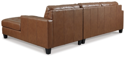 Bask in the beauty of the Baskove sectional. Reserved exclusively for those with an eye for fine contemporary design, this generously scaled sectional in auburn brown is dressed to impress in every way. Real leather throughout the seating area provides incomparable comfort where it counts. Sleek track armrests, tufted box cushions and a sumptuous chaise are the embodiment of luxury.Includes 2 pieces: right-arm facing corner chaise and left-arm facing loveseat | "Left-arm" and "right-arm" describe the position of the arm when you face the piece | Corner-blocked frame | Attached back and loose seat cushions | High-resiliency foam cushions wrapped in thick poly fiber | Leather interior upholstery; vinyl/polyester upholstery | Exposed feet with faux wood finish | Platform foundation system resists sagging 3x better than spring system after 20,000 testing cycles by providing more even support | Smooth platform foundation maintains tight, wrinkle-free look without dips or sags that can occur over time with sinuous spring foundations | Estimated Assembly Time: 5 Minutes