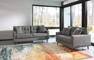 Feed your mid-century modern nostalgia with a contemporary twist in the Zardoni loveseat. Colored in an attractive gray, it’s upholstered in a timeless texture. Classic tufted back and tapered peg legs are a nice revival. Linear profile with two toss pillows adds plenty of fresh style, perfect for small spaces.Corner-blocked frame | Attached back and loose seat cushions | High-resiliency foam cushions wrapped in thick poly fiber | 2 decorative pillows included | Pillows with soft polyfill | Polyester upholstery and pillows | Exposed feet with faux wood finish | Excluded from promotional discounts and coupons