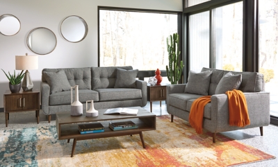 Feed your mid-century modern nostalgia with a contemporary twist in the Zardoni loveseat. Colored in an attractive gray, it’s upholstered in a timeless texture. Classic tufted back and tapered peg legs are a nice revival. Linear profile with two toss pillows adds plenty of fresh style, perfect for small spaces.Corner-blocked frame | Attached back and loose seat cushions | High-resiliency foam cushions wrapped in thick poly fiber | 2 decorative pillows included | Pillows with soft polyfill | Polyester upholstery and pillows | Exposed feet with faux wood finish | Excluded from promotional discounts and coupons