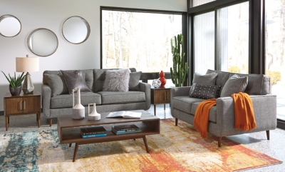 Feed your mid-century modern nostalgia with a contemporary twist in the Zardoni loveseat. Colored in an attractive gray, it’s upholstered in a timeless texture. Classic tufted back and tapered peg legs are a nice revival. Linear profile with two toss pillows adds plenty of fresh style, perfect for small spaces.Corner-blocked frame | Attached back and loose seat cushions | High-resiliency foam cushions wrapped in thick poly fiber | 2 decorative pillows included | Pillows with soft polyfill | Polyester upholstery and pillows | Exposed feet with faux wood finish | Excluded from promotional discounts and coupons