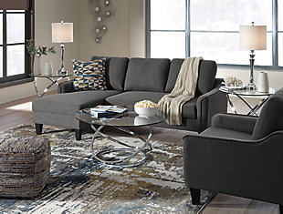 Small space living is easier than ever with the Jarreau sofa chaise sleeper and chair. The sleek silhouette is softened with oversized pillow backs creating a comfortable seating spot. Sporting sleek arms and friendly apartment sizing, these pieces make a fashionable first impression, and help create a blissful contemporary retreat that you’ll want to sink back into every time.Includes sofa chaise sleeper and chair | Corner-blocked frame | Loose cushions | High-resiliency foam cushions wrapped in thick poly fiber | Polyester upholstery | Includes a pullout cushion that sits atop a supportive steel frame | Exposed feet with faux wood finish | Estimated Assembly Time: 30 Minutes