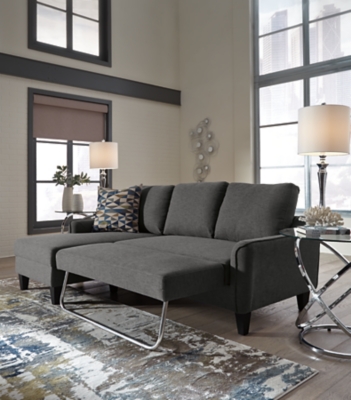 Small space living is easier than ever with the Jarreau sofa chaise sleeper. The soft cushions and oversized pillow backs are sure to be a comfortable seating treat. Sporting sleek arms and friendly apartment sizing, this sleeper makes a fashionable first impression, and is quick to convert into a sleeper with the included pullout cushion. Great to accommodate guests for an overnight stay.Loose cushions | High-resiliency foam cushions wrapped in thick poly fiber | Polyester upholstery | Includes a pullout cushion that sits atop a supportive steel frame | Exposed feet with faux wood finish | Estimated Assembly Time: 15 Minutes