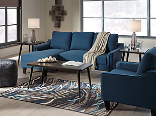 Small space living is easier than ever with the blue Jarreau sofa chaise sleeper. The soft cushions and oversized pillow backs are sure to be a comfortable seating treat. Sporting sleek arms and friendly apartment sizing, this sleeper makes a fashionable first impression, and is quick to convert into a sleeper with the included pullout cushion. Great to accommodate guests for an overnight stay.Loose cushions | High-resiliency foam cushions wrapped in thick poly fiber | Polyester upholstery | Includes a pullout cushion that sits atop a supportive steel frame | Exposed feet with faux wood finish | Estimated Assembly Time: 30 Minutes