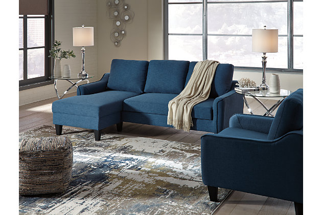 Small space living is looking better than ever with the Jarreau living room set. This high-style ensemble with sofa chaise sleeper and chair entices with soft cushions and oversized pillow backs for a chic seating arrangement. Sporting sleek arms and friendly apartment sizing, the sofa chaise makes a fashionable first impression, and is quick to convert into a sleeper with the included pullout cushion.Includes sofa chaise and chair | Loose cushions | High-resiliency foam cushions wrapped in thick poly fiber | Polyester upholstery | Sofa chaise with pullout cushion that sits atop a supportive steel frame | Exposed feet with faux wood finish | Estimated Assembly Time: 45 Minutes