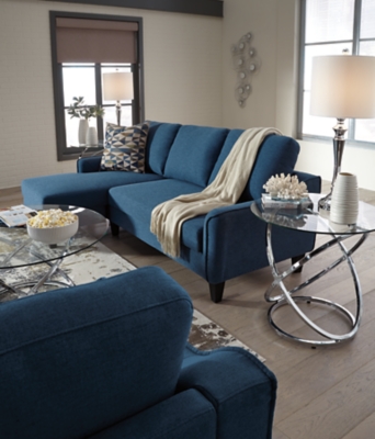 Small space living is easier than ever with the blue Jarreau sofa chaise sleeper. The soft cushions and oversized pillow backs are sure to be a comfortable seating treat. Sporting sleek arms and friendly apartment sizing, this sleeper makes a fashionable first impression, and is quick to convert into a sleeper with the included pullout cushion. Great to accommodate guests for an overnight stay.Loose cushions | High-resiliency foam cushions wrapped in thick poly fiber | Polyester upholstery | Includes a pullout cushion that sits atop a supportive steel frame | Exposed feet with faux wood finish | Estimated Assembly Time: 30 Minutes