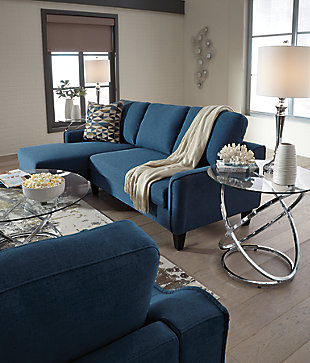 Small space living is easier than ever with the blue Jarreau sofa chaise sleeper. The soft cushions and oversized pillow backs are sure to be a comfortable seating treat. Sporting sleek arms and friendly apartment sizing, this sleeper makes a fashionable first impression, and is quick to convert into a sleeper with the included pullout cushion. Great to accommodate guests for an overnight stay.Loose cushions | High-resiliency foam cushions wrapped in thick poly fiber | Polyester upholstery | Includes a pullout cushion that sits atop a supportive steel frame | Exposed feet with faux wood finish | Estimated Assembly Time: 30 Minutes