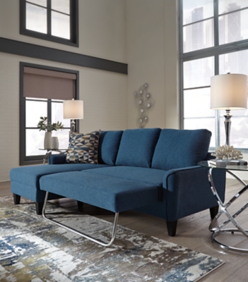 Small space living is easier than ever with the blue Jarreau sofa chaise sleeper. The soft cushions and oversized pillow backs are sure to be a comfortable seating treat. Sporting sleek arms and friendly apartment sizing, this sleeper makes a fashionable first impression, and is quick to convert into a sleeper with the included pullout cushion. Great to accommodate guests for an overnight stay.Loose cushions | High-resiliency foam cushions wrapped in thick poly fiber | Polyester upholstery | Includes a pullout cushion that sits atop a supportive steel frame | Exposed feet with faux wood finish | Estimated Assembly Time: 30 Minutes