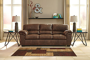 If you love the cool look of leather but long for the warm feel of fabric, you’ll find the Bladen sofa fits the bill beautifully. Rest assured, the textural, multi-tonal upholstery is rich with character and interest—while plush, pillowy cushions merge comfort and support with a high-style design.Corner-blocked frame | Attached back and loose seat cushions | High-resiliency foam cushions wrapped in thick poly fiber | Polyester/polyurethane upholstery | Exposed tapered feet