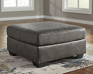 If you love the cool look of leather but long for the warm feel of fabric, you'll find the Bladen oversized ottoman fits the bill beautifully. Enhancing its handsome profile and generous scale: a textural, multi-tonal upholstery that’s loaded with character and interest. A rich addition to your space at a comfortable price.Corner-blocked frame | Firmly cushioned | High-resiliency foam cushion wrapped in thick poly fiber | Polyester/polyurethane upholstery | Exposed tapered feet