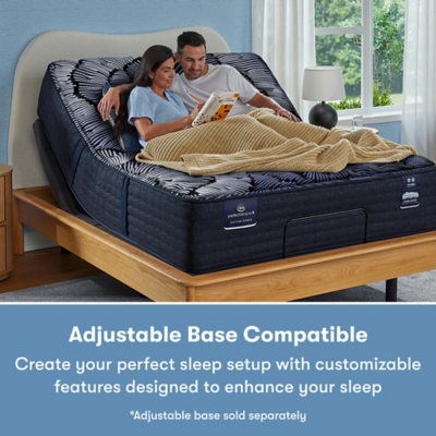 Couple on bed with adjustable base, reading