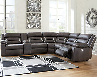 You could play it safe. Or you could choose to stand out in the crowd with the brilliantly styled Kincord sectional with power. Ultra cool, ultra contemporary and ultra comfortable, this fashion-forward sectional sports a fabulous faux leather enhanced with contrasting stitching that’s right on point. Rest assured, sumptuous pillow top armrests and sleek channel cushioning feel every bit as good as they look. Enlightened elements include a power control with USB plug-in and blue LED lighting (by the cup holders) to create a home theater experience worthy of A-listers.Includes 4 pieces: armless chair, right-arm facing zero wall power recliner, left-arm facing power reclining sofa with console and wedge | "Left-arm" and "right-arm" describe the position of the arm when you face the piece | One-touch power control with adjustable positions | Corner-blocked frame with metal reinforced seat | Attached cushions | High-resiliency foam cushions wrapped in thick poly fiber | Includes USB charging port in the power control  | Lift-top storage console includes 2 cup holders with blue LED lighting  | Polyester/polyurethane upholstery | Power cord included; UL Listed | Estimated Assembly Time: 45 Minutes