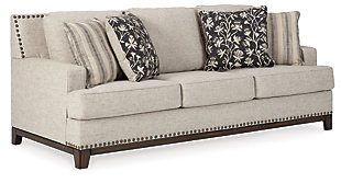 With its uniquely chic blend of elements, the Ballina sofa breaks the rules in a beautiful way. Crisp and clean—with just a hint of classic flair—this designer sofa stands out with its sleek track arms and prominent nailhead trim punctuating the linear profile. Truly setting this contemporary sofa apart—an exposed walnut-tone rail for a high-end, furniture gallery aesthetic. Reversible cushions and decorative pillows in relaxed, muted hues make this sofa befitting everything from modern farmhouse to urban chic spaces.Corner-blocked frame | Reversible cushions | High-resiliency foam cushions wrapped in thick poly fiber | Polyester upholstery | Throw pillows included | Pillows with soft polyfill | Exposed rail and feet with faux wood finish | Platform foundation system resists sagging 3x better than spring system after 20,000 testing cycles by providing more even support | Smooth platform foundation maintains tight, wrinkle-free look without dips or sags that can occur over time with sinuous spring foundations