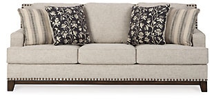 With its uniquely chic blend of elements, the Ballina sofa breaks the rules in a beautiful way. Crisp and clean—with just a hint of classic flair—this designer sofa stands out with its sleek track arms and prominent nailhead trim punctuating the linear profile. Truly setting this contemporary sofa apart—an exposed walnut-tone rail for a high-end, furniture gallery aesthetic. Reversible cushions and decorative pillows in relaxed, muted hues make this sofa befitting everything from modern farmhouse to urban chic spaces.Corner-blocked frame | Reversible cushions | High-resiliency foam cushions wrapped in thick poly fiber | Polyester upholstery | Throw pillows included | Pillows with soft polyfill | Exposed rail and feet with faux wood finish | Platform foundation system resists sagging 3x better than spring system after 20,000 testing cycles by providing more even support | Smooth platform foundation maintains tight, wrinkle-free look without dips or sags that can occur over time with sinuous spring foundations