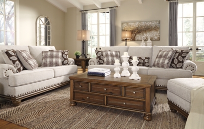 True classic character comes to life in the Harleson sofa. Set back pleated rolled arms and warm brown exposed frame with bun feet are beautifully traditional. Lovely detailing carries itself through the herringbone weave in the soft upholstery. Seat cushions reverse to maintain durable comfort. Vintage-inspired jumbo nailhead trim graces the design. Plaid and botanical pillows in dark brown are a timeless touch.Corner-blocked frame | Attached back and reversible seat cushions | High-resiliency foam cushions wrapped in thick poly fiber | 5 decorative pillows included | Pillows with soft polyfill | Polyester upholstery; Polyester/acrylic/linen and polyester pillows | Bronze-tone nailhead trim | Exposed feet with faux wood finish | Platform foundation system resists sagging 3x better than spring system after 20,000 testing cycles by providing more even support | Smooth platform foundation maintains tight, wrinkle-free look without dips or sags that can occur over time with sinuous spring foundations