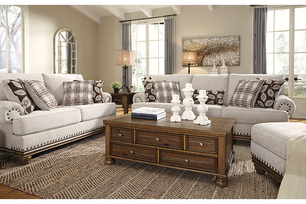 True classic character comes to life in the Harleson sofa. Set back pleated rolled arms and warm brown exposed frame with bun feet are beautifully traditional. Lovely detailing carries itself through the herringbone weave in the soft upholstery. Seat cushions reverse to maintain durable comfort. Vintage-inspired jumbo nailhead trim graces the design. Plaid and botanical pillows in dark brown are a timeless touch.Corner-blocked frame | Attached back and reversible seat cushions | High-resiliency foam cushions wrapped in thick poly fiber | 5 decorative pillows included | Pillows with soft polyfill | Polyester upholstery; Polyester/acrylic/linen and polyester pillows | Bronze-tone nailhead trim | Exposed feet with faux wood finish | Platform foundation system resists sagging 3x better than spring system after 20,000 testing cycles by providing more even support | Smooth platform foundation maintains tight, wrinkle-free look without dips or sags that can occur over time with sinuous spring foundations
