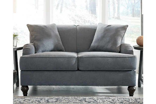 With its graceful curves and rich elements, the Renly loveseat in slate blue embraces a sense of tradition in a way that feels fresh and new. A favorite among romantics, the loveseat's Charles of London arms and rollback profile are beauty to behold. Crisp and clean 2-over-2 cushion styling and monochromatic throw pillows prove that less can be more.Corner-blocked frame | Attached back and loose seat cushions | High-resiliency foam cushions wrapped in thick poly fiber | Polyester upholstery | Throw pillows included | Pillows with soft polyfill | Exposed feet with faux wood finish | Platform foundation system resists sagging 3x better than spring system after 20,000 testing cycles by providing more even support | Smooth platform foundation maintains tight, wrinkle-free look without dips or sags that can occur over time with sinuous spring foundations