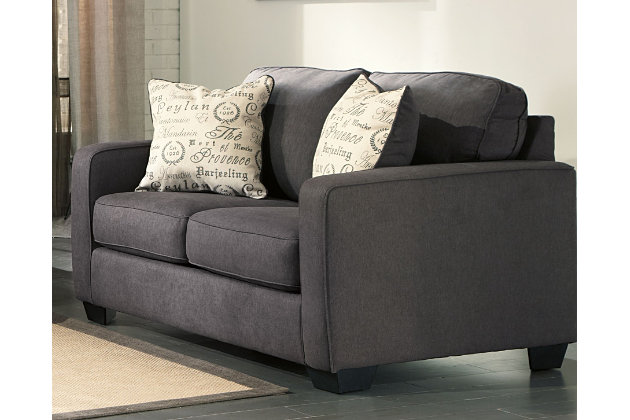The sleek mid-century lines of the Alenya loveseat are always in vogue. With neatly tailored box cushions and track arms, the microfiber upholstered loveseat is supremely comfortable and stylish. Tonal piping and a pair of printed pillows further refine the silhouette.Corner-blocked frame | Attached back and loose seat cushions | High-resiliency foam cushions wrapped in thick poly fiber | 2 decorative pillows included | Pillows with soft polyfill | Upholstery is polyester/nylon | Pillows are linen/viscose | Excluded from promotional discounts and coupons