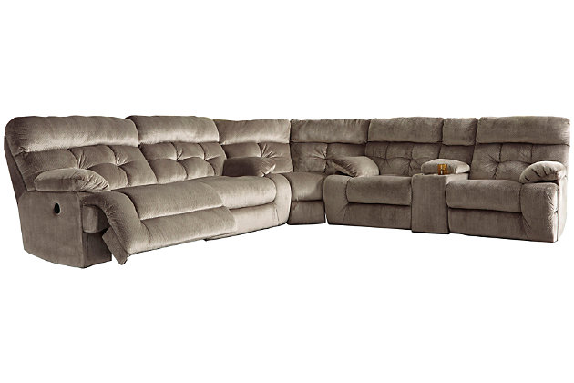 A large scale means large comfort with the Brassville sectional with power. Wonderfully wide seats are upholstered in a textural, cottony soft fabric. Recline as far back as you please on pillowy arms and headrests at one easy touch of a button. Bustle back tufting adds the right amount of casually cool style. With a storage console and two convenient cup holders, you’ll want to stay here forever.Includes 3 pieces: 2-seat reclining power sofa, wedge and double reclining power loveseat with console | Power reclining sofa and power reclining loveseat with one-touch power control with adjustable positions | Console with storage and 2 cup holders | Corner-blocked frame with metal seat | Attached back and seat cushions | High-resiliency foam cushions wrapped in thick poly fiber | Polyester upholstery | Power cord included; UL Listed | Estimated Assembly Time: 10 Minutes