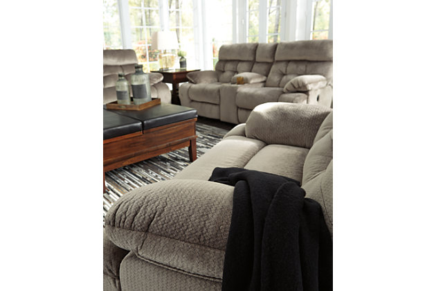 A large scale means large comfort with the Brassville power reclining sofa. Two wonderfully wide seats are upholstered in a textural, cottony soft fabric. Recline as far back as you please on pillowy arms and headrests at one easy touch of a button. Bustle back tufting adds the right amount of casually cool style.Dual-sided recliner | One-touch power control with adjustable positions | Corner-blocked frame with metal reinforced seats | Attached back and seat cushions | High-resiliency foam cushions wrapped in thick poly fiber | Polyester upholstery | Power cord included; UL Listed
