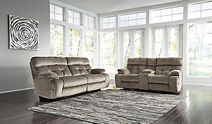 Double up on style and comfort with the Brassville reclining sofa and loveseat. Wonderfully wide seats are upholstered in a textural, cottony soft fabric. Recline as far back as you please on pillowy arms and headrests. Bustle back tufting adds the right amount of casually cool style.Includes reclining sofa and reclining loveseat with console | Dual-sided recliners | Pull tab reclining motion | Corner-blocked frame with metal reinforced seats | Attached back and seat cushions | High-resiliency foam cushions wrapped in thick poly fiber | Loveseat with lift-top storage console and 2 cup holders | Polyester upholstery