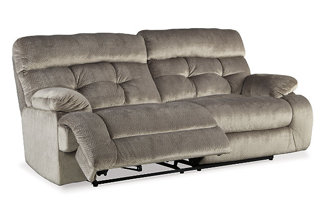 Double up on style and comfort with the Brassville reclining sofa and loveseat. Wonderfully wide seats are upholstered in a textural, cottony soft fabric. Recline as far back as you please on pillowy arms and headrests. Bustle back tufting adds the right amount of casually cool style.Includes reclining sofa and reclining loveseat with console | Dual-sided recliners | Pull tab reclining motion | Corner-blocked frame with metal reinforced seats | Attached back and seat cushions | High-resiliency foam cushions wrapped in thick poly fiber | Loveseat with lift-top storage console and 2 cup holders | Polyester upholstery