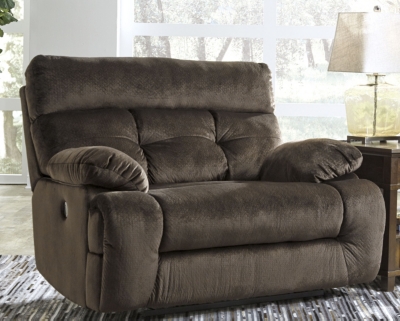 A large scale means large comfort with the Brassville recliner. Wonderfully wide seat is upholstered in a textural, cottony soft fabric. Recline as far back as you please on pillowy arms and headrest. Bustle back tufting adds the right amount of casually cool style.Pull tab reclining motion | Corner-blocked frame with metal reinforced seat | Attached back and seat cushions | High-resiliency foam cushion wrapped in thick poly fiber | Polyester upholstery | Excluded from promotional discounts and coupons