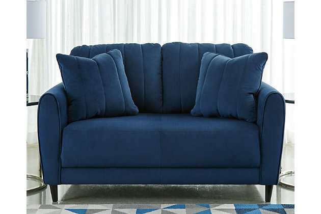 A brilliant take on urban chic styling, the Enderlin loveseat in vibrant blue makes high design highly affordable. Distinctive elements include quilted channel stitching for clean-lined allure and a velvety soft fabric you'll love living with. Sculptural track arms up the wow factor. If you’re looking for big style on more modest scale, you’re sure to appreciate this loveseat’s space-conscious 59" wide profile.Corner-blocked frame | Attached seat cushion | High-resiliency foam cushions wrapped in thick poly fiber | Quilted details | 2 toss pillows included | Pillows with soft polyfill | Velvet polyester upholstery and pillows | Exposed feet with faux wood finish | Platform foundation system resists sagging 3x better than spring system after 20,000 testing cycles by providing more even support | Smooth platform foundation maintains tight, wrinkle-free look without dips or sags that can occur over time with sinuous spring foundations