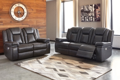 Wouldn’t it be great if the cool look of leather could be blended with the warm feel of fabric? Find a beautiful balance of contemporary style and cozy comfort in the Garristown power reclining sofa. Sporting a sultry gray UltraPella fabric, this chic faux leather sofa is empowering in every which way. The Easy View™ power headrest allows you the perfect view of the TV, even when you’re lying back. And if you’re never far from your cell phone or laptop, you’ll surely appreciate the one-touch power control with USB charging port.Dual-sided recliner; middle seat stays stationary | One-touch power control with adjustable positions | Corner-blocked frame with wooden seat box | Attached back and seat cushions | High-resiliency foam cushions wrapped in thick poly fiber | Easy View™ power adjustable headrest | Includes USB charging port in the power control | Polyester/polyurethane upholstery | Power cord included; UL Listed | Estimated Assembly Time: 30 Minutes