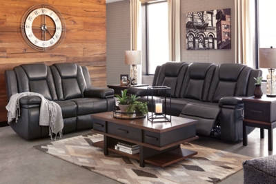 Wouldn’t it be great if the cool look of leather could be blended with the warm feel of fabric? Find a beautiful balance of contemporary style and cozy comfort in the Garristown power reclining sofa. Sporting a sultry gray UltraPella fabric, this chic faux leather sofa is empowering in every which way. The Easy View™ power headrest allows you the perfect view of the TV, even when you’re lying back. And if you’re never far from your cell phone or laptop, you’ll surely appreciate the one-touch power control with USB charging port.Dual-sided recliner; middle seat stays stationary | One-touch power control with adjustable positions | Corner-blocked frame with wooden seat box | Attached back and seat cushions | High-resiliency foam cushions wrapped in thick poly fiber | Easy View™ power adjustable headrest | Includes USB charging port in the power control | Polyester/polyurethane upholstery | Power cord included; UL Listed | Estimated Assembly Time: 30 Minutes