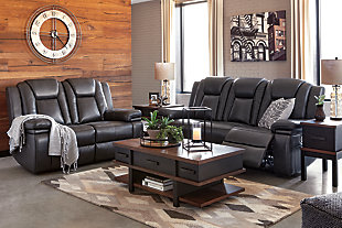 Wouldn’t it be great if the cool look of leather could be blended with the warm feel of fabric? Find a beautiful balance of contemporary style and cozy comfort in the Garristown power reclining sofa. Sporting a sultry gray UltraPella fabric, this chic faux leather sofa is empowering in every which way. The Easy View™ power headrest allows you the perfect view of the TV, even when you’re lying back. And if you’re never far from your cell phone or laptop, you’ll surely appreciate the one-touch power control with USB charging port.Dual-sided recliner; middle seat stays stationary | One-touch power control with adjustable positions | Corner-blocked frame with wooden seat box | Attached back and seat cushions | High-resiliency foam cushions wrapped in thick poly fiber | Easy View™ power adjustable headrest | Includes USB charging port in the power control | Polyester/polyurethane upholstery | Power cord included; UL Listed | Estimated Assembly Time: 30 Minutes