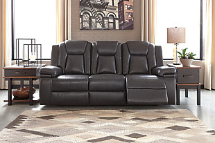 Wouldn’t it be great if the cool look of leather could be blended with the warm feel of fabric? Find a beautiful balance of contemporary style and cozy comfort in the Garristown power reclining sofa. Sporting a sultry gray UltraPella fabric, this chic faux leather sofa is empowering in every which way. The Easy View™ power headrest allows you the perfect view of the TV, even when you’re lying back. And if you’re never far from your cell phone or laptop, you’ll surely appreciate the one-touch power control with USB charging port.Dual-sided recliner; middle seat stays stationary | One-touch power control with adjustable positions | Corner-blocked frame with wooden seat box | Attached back and seat cushions | High-resiliency foam cushions wrapped in thick poly fiber | Easy View™ power adjustable headrest | Includes USB charging port in the power control | Polyester/polyurethane upholstery | Power cord included; UL Listed | Estimated Assembly Time: 30 Minutes