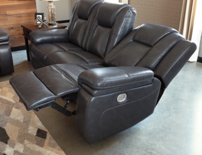 Wouldn’t it be great if the cool look of leather could be blended with the warm feel of fabric? Find a beautiful balance of contemporary style and cozy comfort in the Garristown power reclining sofa. Sporting a sultry gray UltraPella fabric, this chic faux leather sofa is empowering in every which way. The Easy View™ power headrest allows you the perfect view of the TV, even when you’re lying back. And if you’re never far from your cell phone or laptop, you’ll surely appreciate the one-touch power control with USB charging port.Dual-sided recliner; middle seat stays stationary | One-touch power control with adjustable positions | Corner-blocked frame with wooden seat box | Attached back and seat cushions | High-resiliency foam cushions wrapped in thick poly fiber | Easy View™ power adjustable headrest | Includes USB charging port in the power control | Polyester/polyurethane upholstery | Power cord included; UL Listed | Estimated Assembly Time: 30 Minutes