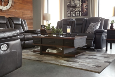 Wouldn’t it be great if the cool look of leather could be blended with the warm feel of fabric? Find a beautiful balance of contemporary style and cozy comfort in the Garristown power reclining sofa. Sporting a sultry gray UltraPella fabric, this chic faux leather sofa is empowering in every which way. The Easy View™ power headrest allows you the perfect view of the TV, even when you’re lying back. And if you’re never far from your cell phone or laptop, you’ll surely appreciate the one-touch power control with USB charging port.Dual-sided recliner; middle seat stays stationary | One-touch power control with adjustable positions | Corner-blocked frame with wooden seat box | Attached back and seat cushions | High-resiliency foam cushions wrapped in thick poly fiber | Easy View™ power adjustable headrest | Includes USB charging port in the power control | Polyester/polyurethane upholstery | Power cord included; UL Listed | Estimated Assembly Time: 30 Minutes