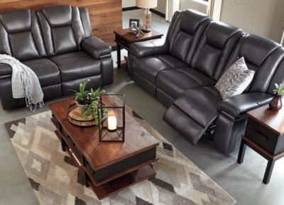 Wouldn’t it be great if the cool look of leather could be blended with the warm feel of fabric? Find a beautiful balance of contemporary style and cozy comfort in the Garristown power reclining sofa. Sporting a sultry gray UltraPella fabric, this chic faux leather sofa is empowering in every which way. The Easy View™ power headrest allows you the perfect view of the TV, even when you’re lying back. And if you’re never far from your cell phone or laptop, you’ll surely appreciate the one-touch power control with USB charging port.Dual-sided recliner; middle seat stays stationary | One-touch power control with adjustable positions | Corner-blocked frame with wooden seat box | Attached back and seat cushions | High-resiliency foam cushions wrapped in thick poly fiber | Easy View™ power adjustable headrest | Includes USB charging port in the power control | Polyester/polyurethane upholstery | Power cord included; UL Listed | Estimated Assembly Time: 30 Minutes