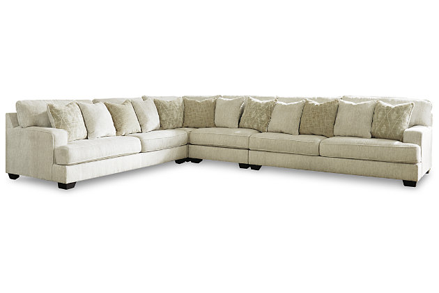 If you love the idea of contemporary style that’s ultra warm and inviting, the Rawcliffe sectional is casual refinement you’ll love living with. Lightening things up in a fresh neutral tone, this sectional is covered in a decadently soft microfiber that’s love at first touch. Rest assured, ultra-deep 45" seats and reversible cushions you can flip and fluff nicely accommodate, while clean-lined styling and wide track arms make a fashion statement.Includes 4 pieces: armless chair, left-arm facing sofa, right-arm facing sofa and wedge | "Left-arm" and "right-arm" describe the position of the arm when you face the piece | Corner-blocked frame | Loose, reversible cushions | High-resiliency foam cushions wrapped in thick poly fiber | 12 accent pillows included | Pillows with soft polyfill | Polyester upholstery and pillows | Exposed feet with faux wood finish | Platform foundation system resists sagging 3x better than spring system after 20,000 testing cycles by providing more even support | Smooth platform foundation maintains tight, wrinkle-free look without dips or sags that can occur over time with sinuous spring foundations | Estimated Assembly Time: 15 Minutes