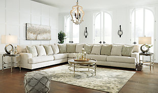 If you love the idea of contemporary style that’s ultra warm and inviting, the Rawcliffe sectional is casual refinement you’ll love living with. Lightening things up in a fresh neutral tone, this sectional is covered in a decadently soft microfiber that’s love at first touch. Rest assured, ultra-deep 45" seats and reversible cushions you can flip and fluff nicely accommodate, while clean-lined styling and wide track arms make a fashion statement.Includes 4 pieces: armless chair, left-arm facing sofa, right-arm facing sofa and wedge | "Left-arm" and "right-arm" describe the position of the arm when you face the piece | Corner-blocked frame | Loose, reversible cushions | High-resiliency foam cushions wrapped in thick poly fiber | 12 accent pillows included | Pillows with soft polyfill | Polyester upholstery and pillows | Exposed feet with faux wood finish | Platform foundation system resists sagging 3x better than spring system after 20,000 testing cycles by providing more even support | Smooth platform foundation maintains tight, wrinkle-free look without dips or sags that can occur over time with sinuous spring foundations | Estimated Assembly Time: 15 Minutes