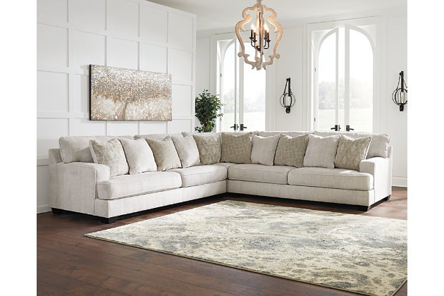 If you love the idea of contemporary style that’s ultra warm and inviting, the Rawcliffe sectional is casual refinement you’ll love living with. Lightening things up in a fresh neutral tone, this sectional is covered in a decadently soft microfiber that’s love at first touch. Rest assured, ultra-deep 45" seats and reversible cushions you can flip and fluff nicely accommodate, while clean-lined styling and wide track arms make a fashion statement.Includes 3 pieces: left-arm facing sofa, right-arm facing sofa and wedge | "Left-arm" and "right-arm" describe the position of the arm when you face the piece | Corner-blocked frame | Loose, reversible cushions | High-resiliency foam cushions wrapped in thick poly fiber | 10 accent pillows included | Pillows with soft polyfill | Polyester upholstery and pillows | Exposed feet with faux wood finish | Platform foundation system resists sagging 3x better than spring system after 20,000 testing cycles by providing more even support | Smooth platform foundation maintains tight, wrinkle-free look without dips or sags that can occur over time with sinuous spring foundations | Estimated Assembly Time: 10 Minutes