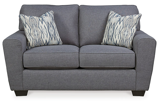This 5-piece living room set is sure to elevate your living space with a high-end look and fresh, contemporary flair. Sitting pretty: the Calion sofa and loveseat, sporting a linen-weave upholstery that complements so many color schemes and aesthetics. Flared arms, prominent welting and flamestitch-print pillows add just enough panache to this stylish ensemble. And talk about the perfect accompaniment: the Denja coffee table and matching end tables with ultra clean lines, a rich dark finish and black glass inserts for added drama.Living room set with sofa, loveseat, 1 coffee table and 2 end tables | Corner-blocked frame | Attached back and loose seat cushions | High-resiliency foam cushions wrapped in thick poly fiber | 6 decorative pillows included | Pillows with soft polyfill | Polyester upholstery and pillows  | Exposed feet with faux wood finish | Hand-finished tables made of veneers, wood, engineered wood and glass  | Tabletops with inset black colored glass | Tables require assembly