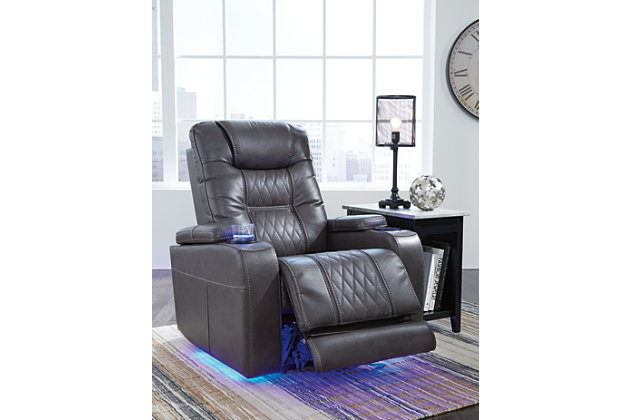 Movie nights will be forever changed with the Composer power recliner. The adjustable Easy View™ headrest allows a primo view of the TV no matter how far back you recline and the extended ottoman provides extra room to really stretch out. Ultra-cool lattice stitching elevates the look and ambient LED lighting completes the theater-style experience. So relax, kick off your shoes and enjoy the show.One-touch power control with adjustable positions | Corner-blocked frame with metal reinforced seat | Attached back and seat cushions | High-resiliency foam cushions wrapped in thick poly fiber | Easy View™ power adjustable headrest | Includes USB charging port in the power control | Extended ottoman for enhanced comfort | Ambient blue LED lighting on cup holders and base for a theater-style experience | Polyester/polyurethane upholstery | Power cord included; UL Listed | Estimated Assembly Time: 15 Minutes
