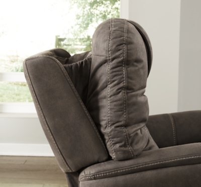 Take charge of your seating with the Ballister power lift recliner. Its easy power button motion control allows you the full spectrum of comfort—from a gentle lift-and-tilt for standing up to a lay flat design ideal for an afternoon snooze. Not much gets past the power adjustable headrest and lumbar support, or even the independent motor controls to get that just right position. You’ll always stay connected with the included USB charging port in the power control, and relish in the hours of versatile support that never stops giving.One-touch (hand control) power button with adjustable positions | Easy View™ power adjustable headrest and power lumbar support | Corner-blocked frame with metal reinforced seat | Attached back and seat cushions | High-resiliency foam cushions wrapped in thick poly fiber | Side pocket storage | Includes USB charging port in the power control | Dual motors control the footrest and back independently for custom comfort positioning | Lay flat design for extended naptime comfort | Polyester upholstery | Compatible with emergency battery backup (sold separately), in case of power outage | Power cord included; UL Listed | Estimated Assembly Time: 15 Minutes