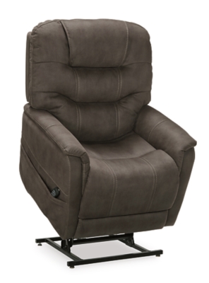 Take charge of your seating with the Ballister power lift recliner. Its easy power button motion control allows you the full spectrum of comfort—from a gentle lift-and-tilt for standing up to a lay flat design ideal for an afternoon snooze. Not much gets past the power adjustable headrest and lumbar support, or even the independent motor controls to get that just right position. You’ll always stay connected with the included USB charging port in the power control, and relish in the hours of versatile support that never stops giving.One-touch (hand control) power button with adjustable positions | Easy View™ power adjustable headrest and power lumbar support | Corner-blocked frame with metal reinforced seat | Attached back and seat cushions | High-resiliency foam cushions wrapped in thick poly fiber | Side pocket storage | Includes USB charging port in the power control | Dual motors control the footrest and back independently for custom comfort positioning | Lay flat design for extended naptime comfort | Polyester upholstery | Compatible with emergency battery backup (sold separately), in case of power outage | Power cord included; UL Listed | Estimated Assembly Time: 15 Minutes