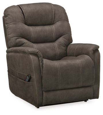 Take charge of your seating with the Ballister power lift recliner. Its easy power button motion control allows you the full spectrum of comfort—from a gentle lift-and-tilt for standing up to a lay flat design ideal for an afternoon snooze. Not much gets past the power adjustable headrest and lumbar support, or even the independent motor controls to get that just right position. You’ll always stay connected with the included USB charging port in the power control, and relish in the hours of versatile support that never stops giving.One-touch (hand control) power button with adjustable positions | Easy View™ power adjustable headrest and power lumbar support | Corner-blocked frame with metal reinforced seat | Attached back and seat cushions | High-resiliency foam cushions wrapped in thick poly fiber | Side pocket storage | Includes USB charging port in the power control | Dual motors control the footrest and back independently for custom comfort positioning | Lay flat design for extended naptime comfort | Polyester upholstery | Compatible with emergency battery backup (sold separately), in case of power outage | Power cord included; UL Listed | Estimated Assembly Time: 15 Minutes